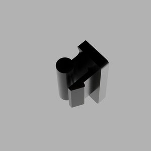 May include: Black plastic clip with a rounded edge and a rectangular base. The clip is designed to hold objects together.