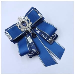 Womens handmade tie with a silver brooch with rhinestones.