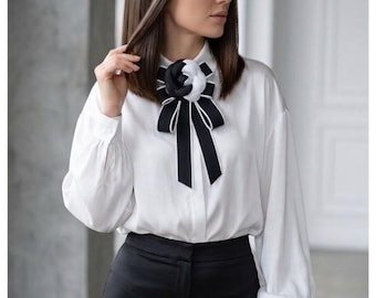 Womens black and white tie, decorated with fabric rose accents. Handmade.