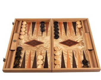 May include: A wooden backgammon set with a light wood grain finish. The game board is open, revealing a pattern of brown and tan triangles, with light and dark game pieces. The set includes a wooden case and dice cups.