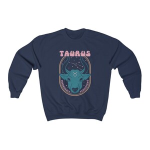 May include: Navy blue sweatshirt with a graphic of a bull's head with stars and the text "Taurus, Dependable, Persistent".