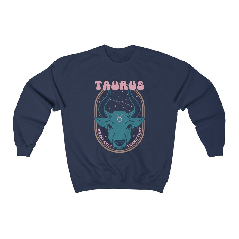May include: Navy blue sweatshirt with a graphic of a bull's head with stars and the text "Taurus, Dependable, Persistent".