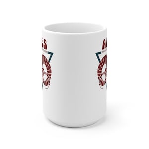 May include: White ceramic mug with a red and blue graphic of an astrological ram with the text "Aries" and "Passionate, Independent" on either side of the ram.
