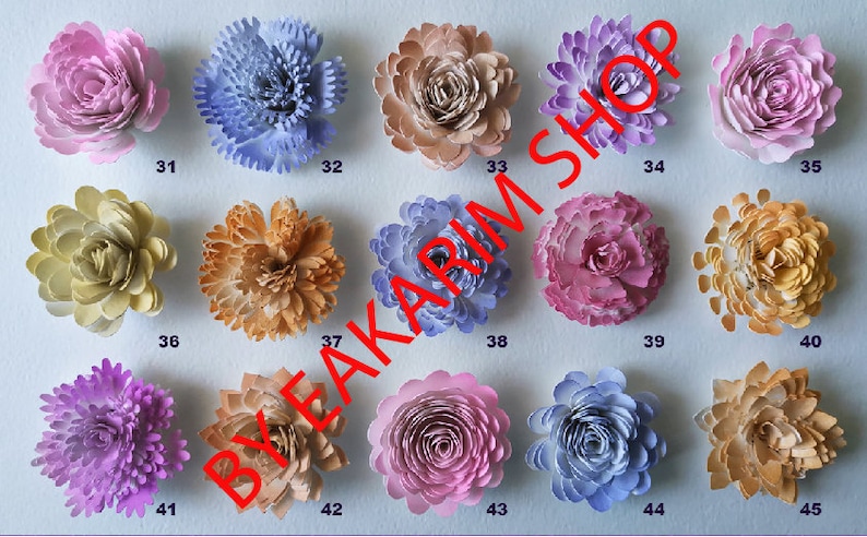 May include: A collection of 15 paper flowers in various colors, including pink, purple, blue, yellow, and brown. The flowers are arranged in rows of five, with numbers 31 through 45 printed below each flower.