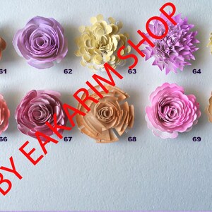 May include: Ten paper flowers in various colors and styles, including peach, pink, and yellow. The flowers are arranged in two rows of five. Each flower is numbered 61 through 70.