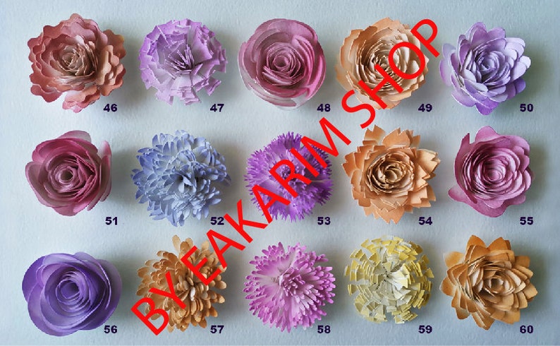 May include: Sixty paper flowers in various colors and styles, including pink, purple, yellow, and orange. The flowers are arranged in rows on a white background. The image includes the text "BYFAKARIM SHOP".