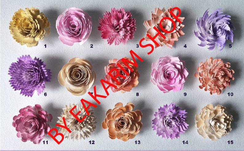May include: Fifteen paper flowers in various colors and styles, including roses, carnations, and other floral designs. The flowers are numbered 1 through 15.