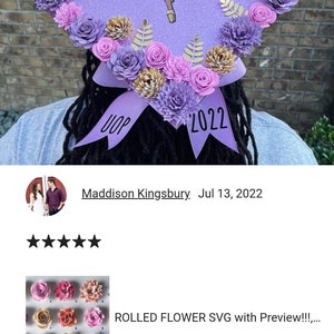 May include: Purple graduation cap decorated with paper flowers in shades of pink, purple, and gold. The cap has the text "I chose my path but God ordered my steps" and "UOP 2022".