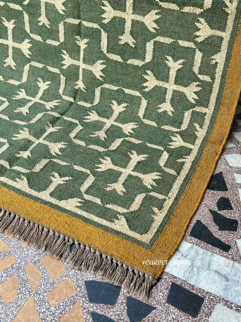 Green Kilim Navajo Rug | Vintage Southwestern Home Decor | Handmade Flatweave Dhurrie | Traditional Indian Peruvian Jute Kilim | Custom Area Rug

Introduce a blend of cultural elegance and earthy charm to living space with our Green Kilim Navajo Rug.