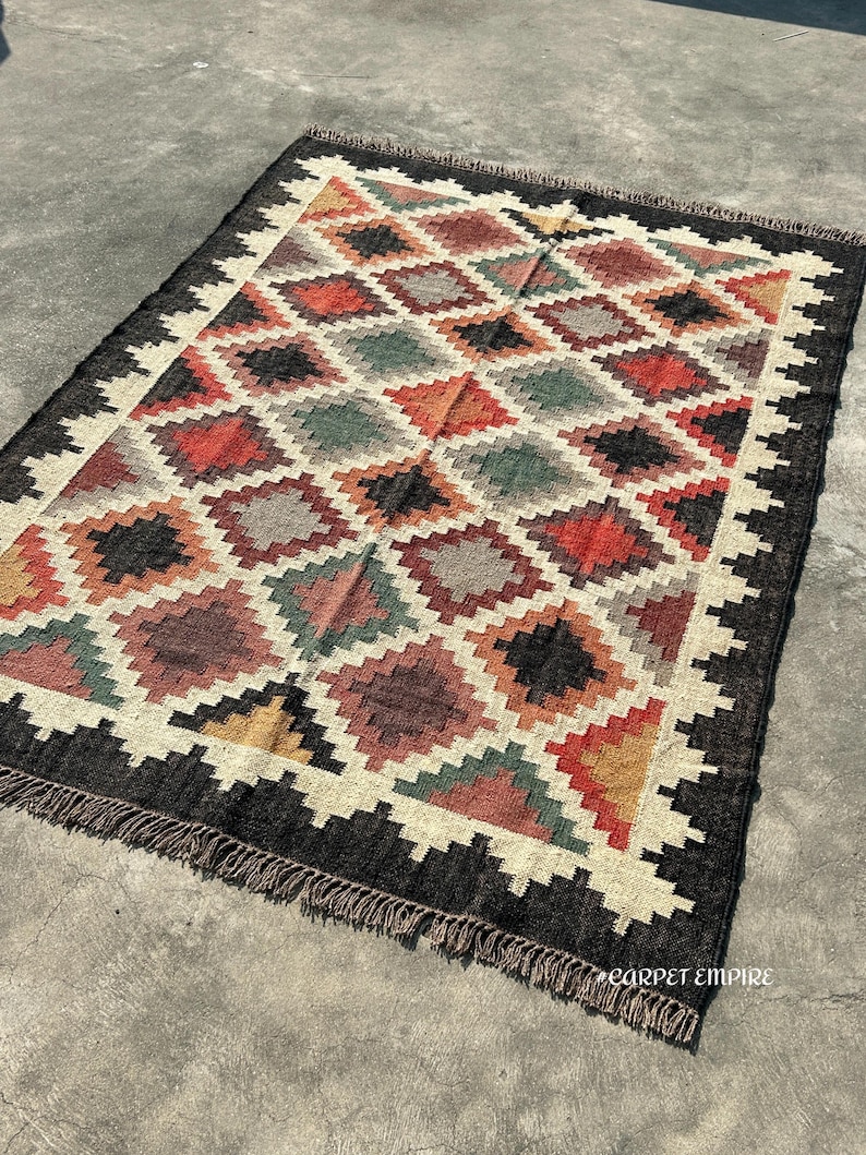 Boho handcrafted Kilim Area Rug in jute and wool blend — multicolor tribal diamond design with hand-knotted fringe.
