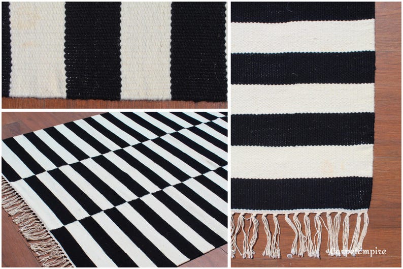 A statement piece for minimalist and contemporary homes, this striped wool rug features a timeless black and white palette. The handwoven wool fibers offer exceptional durability and warmth, making it ideal for living rooms, bedrooms, and office spaces. Whether styled as a focal point or layered with other decor elements, this rug enhances your space effortlessly.