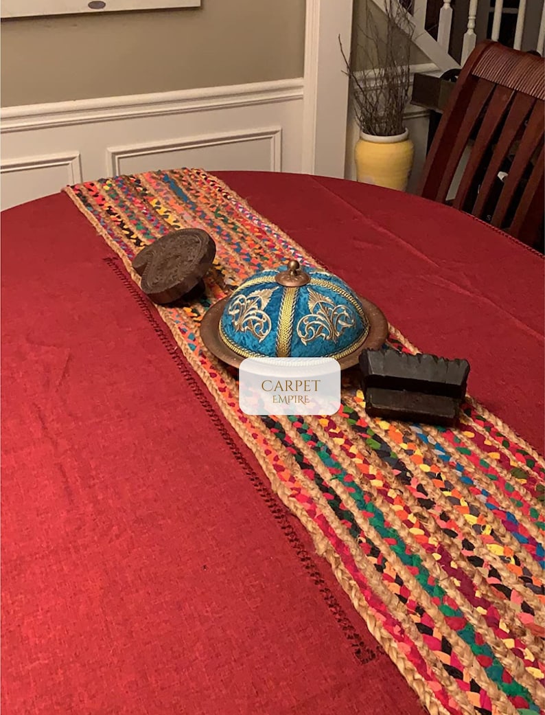 Bohemian table runner crafted from sustainable jute and cotton, perfect for vibrant home accents

Recycled cotton and jute table runner with bold rainbow colors, suited for indoor and outdoor use

Flatweave colorful table runner with hand-loomed chindi stripes, artisan-made from natural materials