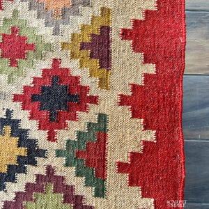 Expertly handwoven using premium wool and jute, this flatweave rug is both durable and lightweight, making it ideal for high-traffic areas. Its custom size options, including 9x12 ft, 10x14 ft, and runners