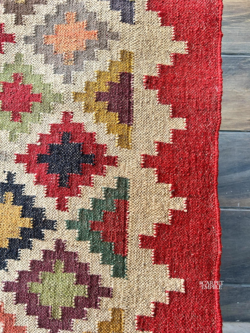 Expertly handwoven using premium wool and jute, this flatweave rug is both durable and lightweight, making it ideal for high-traffic areas. Its custom size options, including 9x12 ft, 10x14 ft, and runners