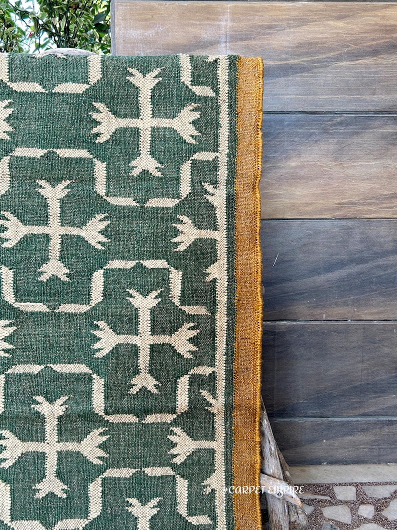 Whether you're styling your living room, bedroom, or outdoor patio, this versatile rug adds warmth, texture, and a unique global appeal.

Designed for high-traffic areas, the Green Kilim Navajo Rug is durable and easy to maintain