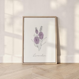 Puede incluir: Una impresión artística enmarcada con un dibujo lineal minimalista de flores de lavanda. La obra de arte incluye acentos morados y la palabra "Lavander" en una fuente de escritura. El marco es de color madera clara.
