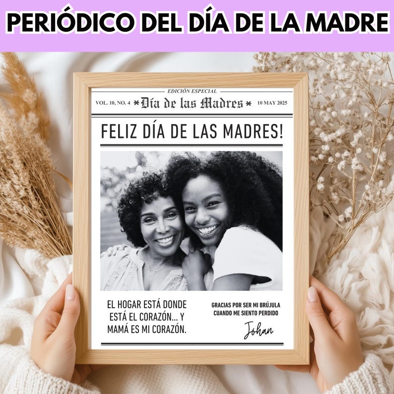 May include: A framed newspaper print with the headline "PERI&Oacute;DICO DEL D&Iacute;A DE LA MADRE" and "FELIZ D&Iacute;A DE LAS MADRES!" in Spanish. The image features a black and white photo of two smiling women. Text includes "El hogar est&aacute; donde est&aacute; el coraz&oacute;n... y mam&aacute; es mi coraz&oacute;n."