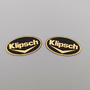 2 pcs. plastic oval badge with Klipsch logo in gold, silver, white