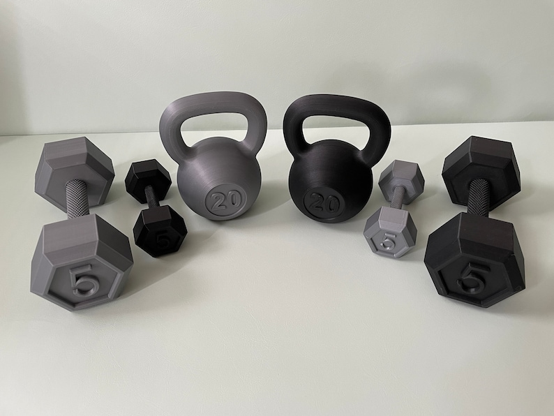 May include: A set of gray and black kettlebells and dumbbells. The kettlebells are labeled "20" and the dumbbells are labeled "5".