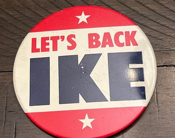 May include: Red, white, and blue button with the text "Let's Back Ike" and two stars.
