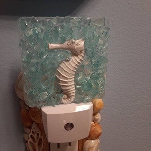 Coastal seahorse and seaglass nightlight with light sensor.