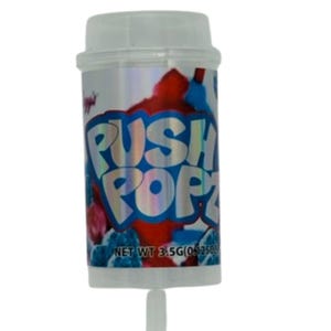 May include: A Push Popz candy container with a white cap and a push-up stick. The container has a silver background with red and blue abstract designs. The words "PUSH POPZ" are in large, blue, bubble letters.
