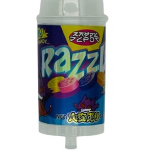 May include: A cylindrical candy container with a white cap and base. The label is blue with the word "Razzl" in large, colorful letters. The container features cartoon graphics and Japanese text. The net weight is 35g.
