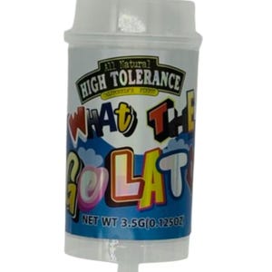 May include: A cylindrical container with a white lid and a clear bottom. The container has a label with the text "All Natural High Tolerance" and "What The Golat". The net weight is 0.125 oz.