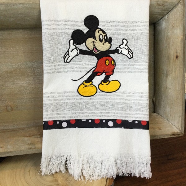 Mickey Mouse embroidered tea towel with fringe and dotted ribbon