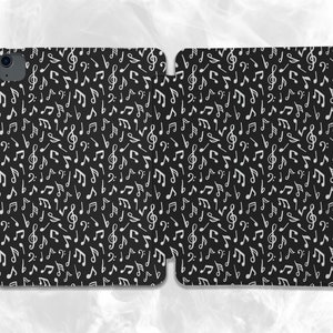 May include: Black phone case with a white musical note pattern. The case is made of a durable material and is designed to protect your phone from scratches and bumps.