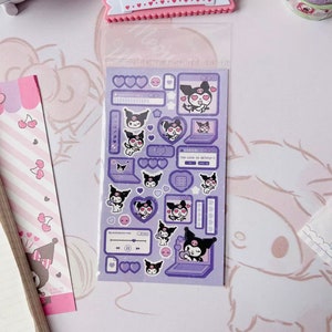 May include: A sheet of purple and white stickers featuring a cartoon character with black hair and a pink bow. The stickers include hearts, stars, and the text "Too cute to delete!"