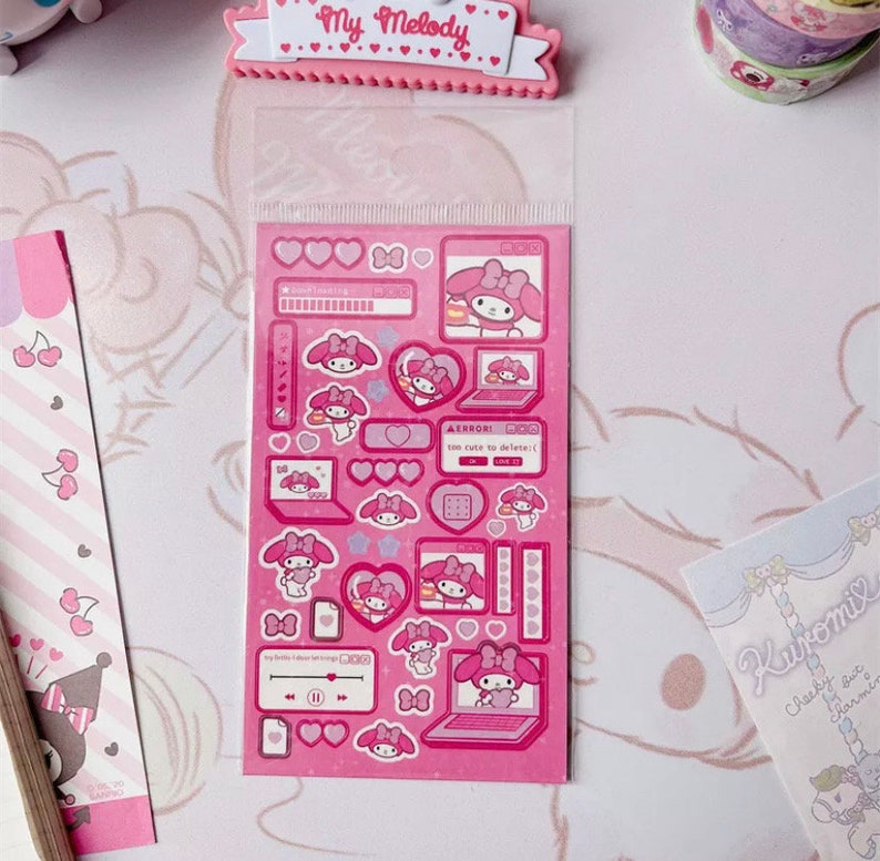 May include: A sheet of pink and white stickers featuring My Melody, a popular Japanese character. The stickers feature My Melody in various poses, including on a computer, holding a heart, and wearing a bow. The stickers are perfect for adding a touch of cuteness to your planner, journal, or laptop.