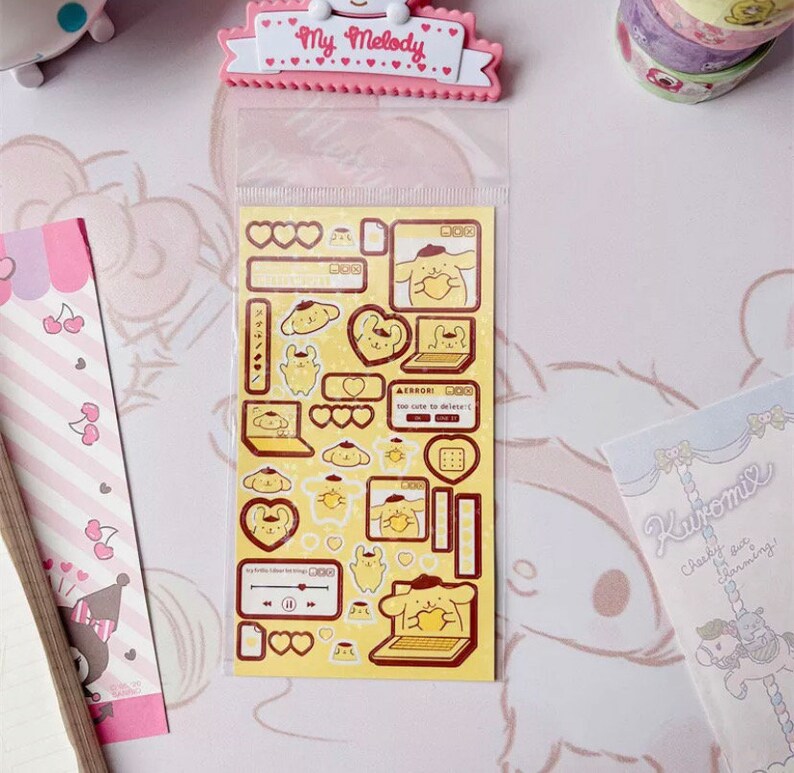 May include: A sheet of stickers featuring a yellow cartoon dog wearing a beret and holding a heart. The stickers are on a yellow background with red hearts and other details. The text on the stickers reads "ERROR! Too cute to delete!"