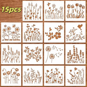 May include: A collection of 15 wooden stencils with floral and botanical designs. Each square stencil showcases a different flower, plant, or leaf pattern. The stencils are brown and set against a white background.
