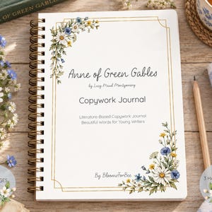 May include: A spiral-bound copywork journal titled Anne of Green Gables by Lucy Maud Montgomery. The white cover features a gold rectangular border and watercolor illustrations of daisies and blue wildflowers in the top-left and bottom-right corners.