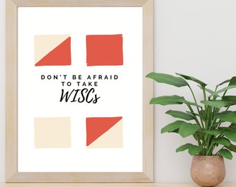 Può includere: Stampa artistica incorniciata con un design minimalista. La stampa presenta quattro forme astratte nei colori rosso e crema, con il testo "DON'T BE AFRAID TO TAKE WISCs" in nero. L'opera d'arte è esposta su una superficie di legno.