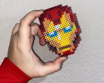 Iron Man - hama perler beads. I want to turn one of his arms upside down so  that the flame is pointing above his head, th…