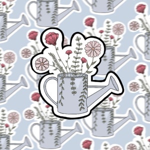 Arrosoir avec fleurs