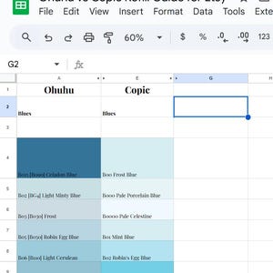 May include: A spreadsheet comparing Ohuhu and Copic refill colours, titled "Ohuhu vs Copic Refill Guide for Etsy." The colour swatches are in shades of blue, with colour names and codes listed for each brand. The spreadsheet is open in a Google Sheets document.