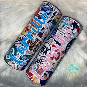 May include: Two white stainless steel tumblers with colorful stickers and the names "Carrillo" and "Carrillo" written in blue and pink lettering.