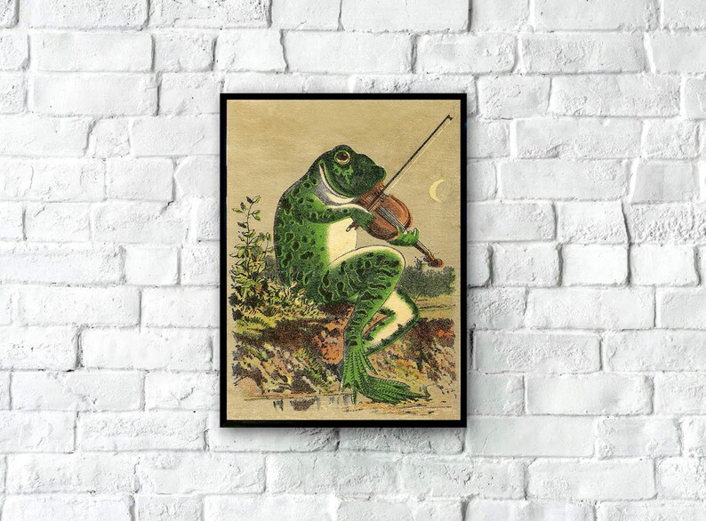 May include: A vintage illustration of a green frog playing a violin under a crescent moon. The frog is sitting on a rock with green foliage behind it.