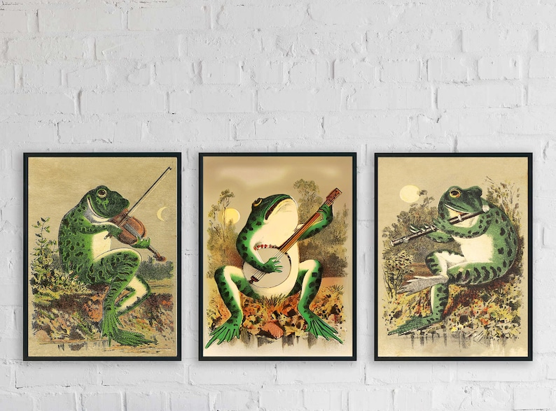 May include: Three framed illustrations of frogs playing musical instruments. The first frog plays a violin, the second plays a banjo, and the third plays a flute. The illustrations are in a vintage style with a light brown background.