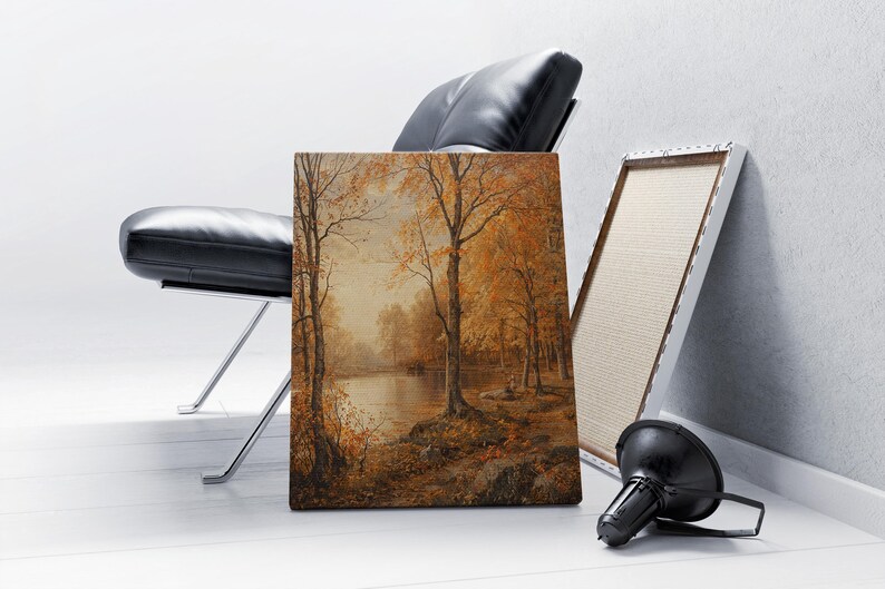 May include: A painting of a forest scene with a lake in the background. The trees are mostly brown and yellow, and the lake is a light blue. The painting is framed in a simple wooden frame.
