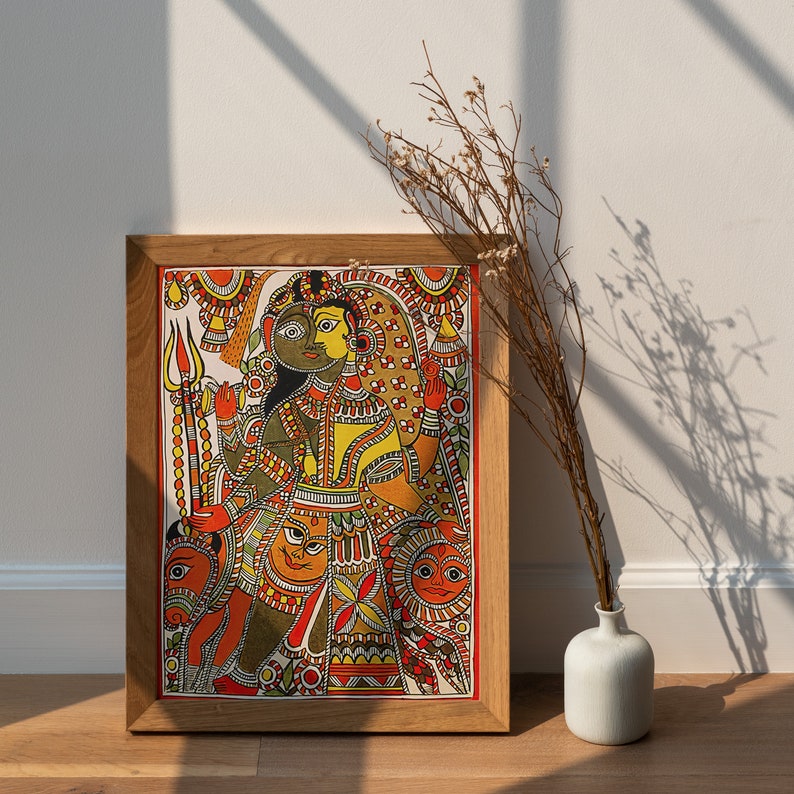 May include: A framed painting of a colorful Indian folk art style depicting a couple in traditional clothing. The painting is set against a white wall with a dried flower arrangement in a white vase.