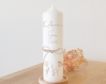 Natural wedding candle with cream-colored ribbon