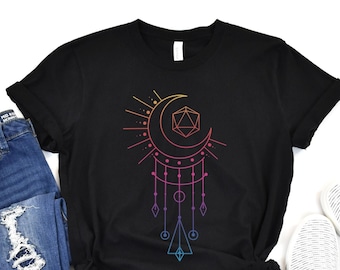 May include: Black t-shirt with a rainbow gradient design of a crescent moon, a sun, and a 20-sided die.