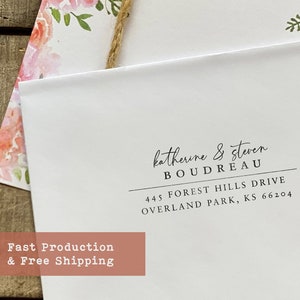 May include: A white envelope with a return address label. The label has the text "katherine & steven BOUDREAU 445 FOREST HILLS DRIVE OVERLAND PARK, KS 66204".