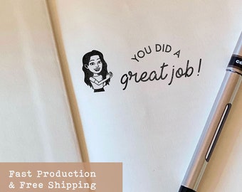 May include: A black and white illustration of a person clapping with the text "You did a great job!"  The illustration is on a white background with a silver pen.