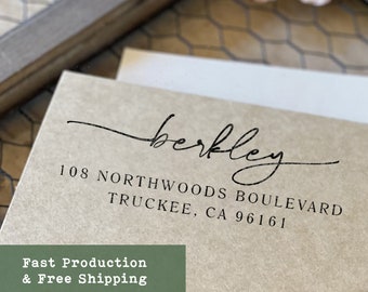 May include: A light brown paper envelope featuring black printed text that reads berkley followed by the address 108 NORTHWOODS BOULEVARD TRUCKEE, CA 96161. The envelope is positioned against a neutral background with a wooden frame edge.
