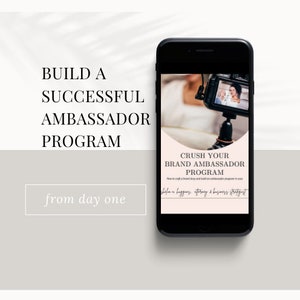 May include: A smartphone screen displaying a pink and white graphic with the text "Crush Your Brand Ambassador Program" and "How to craft a brand story and build an ambassador program in 2023". The graphic also includes the text "befaa hugging, attorney & business strategist".